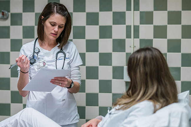 Student nurse with patient