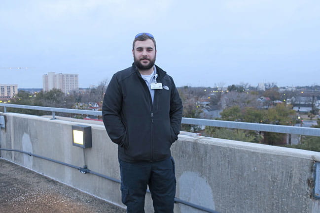 Connor Roberson stands in parking garage