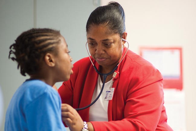 Dr Sherron M. Jackson examines a sickle cell patient