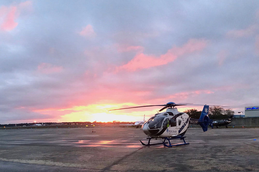 MEDUCARE One, a Eurocopter EC135 P2+ helicopter, sits on the tarmac at the command center at Charleston International Airport. Photo by Bryce Donovan