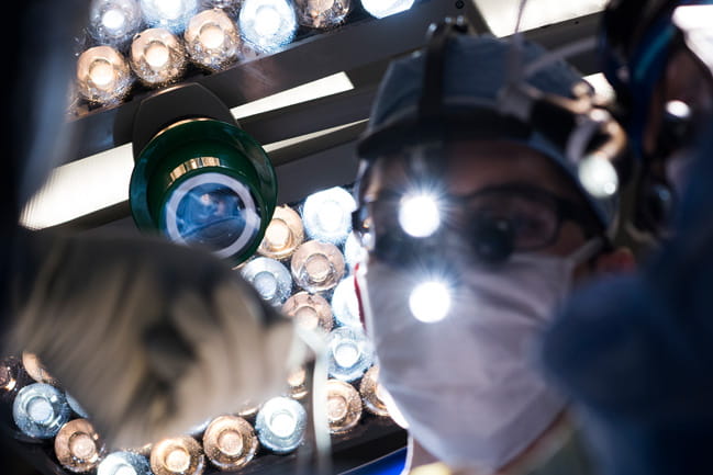 Surgeon performing facial paralysis surgery