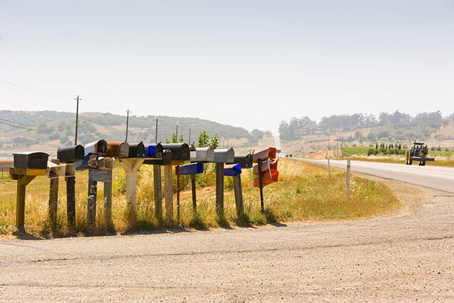 Row of mailboxes along country dirt road