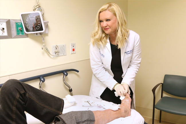 Vascular surgeon examining a patient’s foot at MUSC 